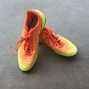 Orange and yellow Nike cleats size 6 in men’s